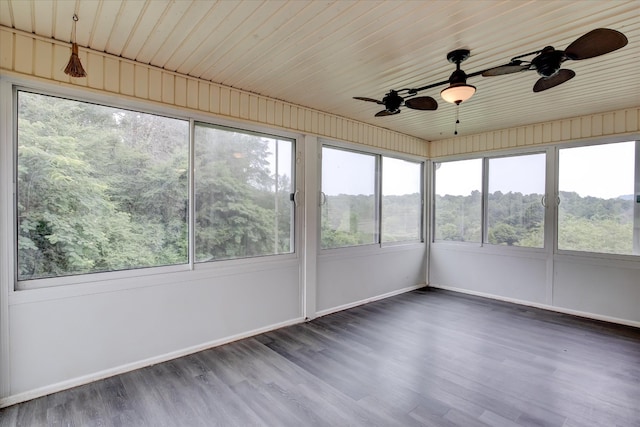 unfurnished sunroom featuring ceiling fan