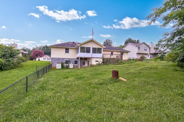 back of house with a yard