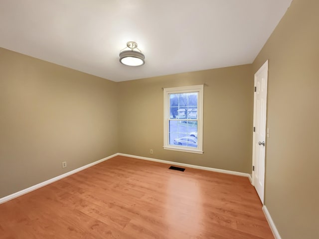 unfurnished room featuring light hardwood / wood-style flooring