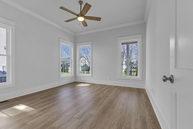 unfurnished room with ornamental molding, ceiling fan, and light wood-type flooring