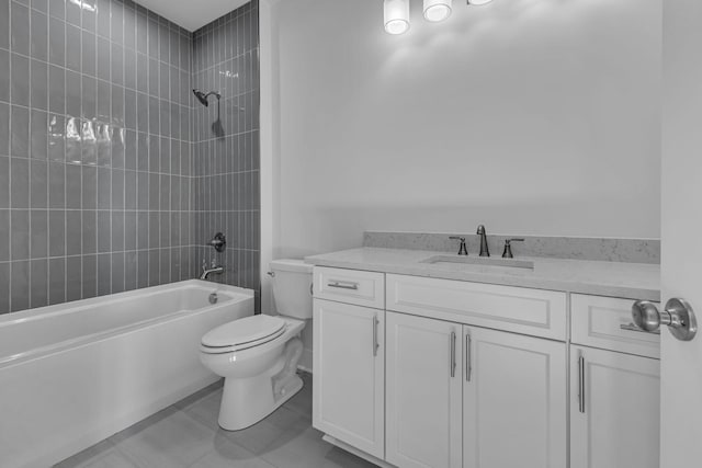 full bathroom featuring vanity, toilet, tile patterned floors, and tiled shower / bath