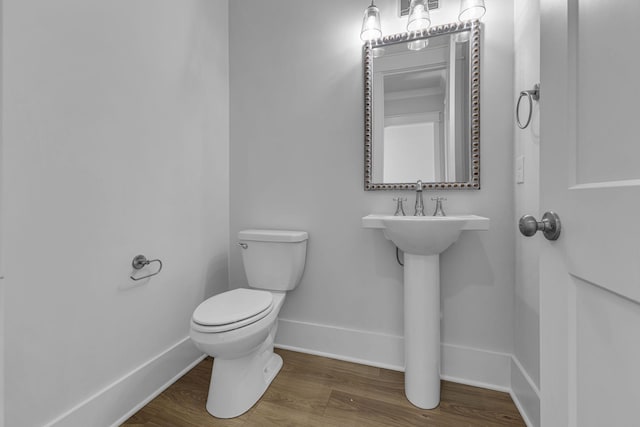 bathroom featuring toilet and hardwood / wood-style floors