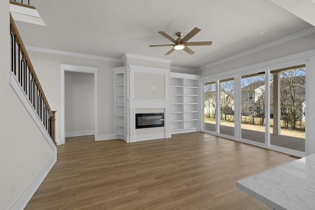 unfurnished living room with ornamental molding, dark hardwood / wood-style floors, and ceiling fan