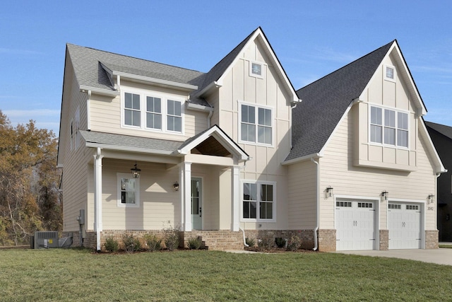 view of front of house featuring a garage and a front lawn