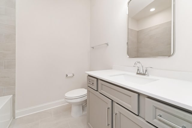 bathroom with tile patterned flooring, vanity, and toilet