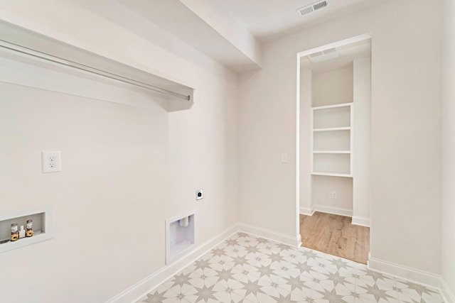 laundry room featuring hookup for an electric dryer, laundry area, washer hookup, visible vents, and light floors