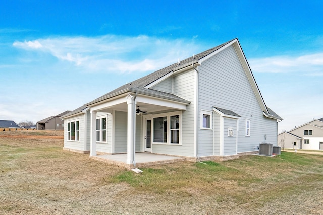 back of house with central AC unit, a yard, a patio area, and ceiling fan