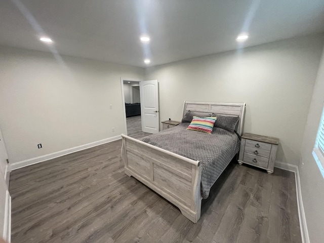 bedroom featuring dark hardwood / wood-style flooring