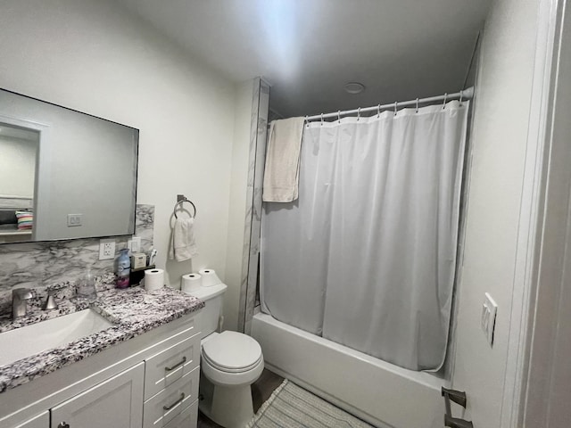 full bathroom with vanity, tasteful backsplash, toilet, and shower / bath combo with shower curtain