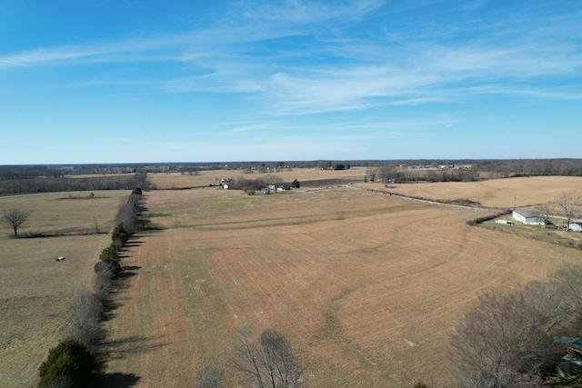 birds eye view of property with a rural view