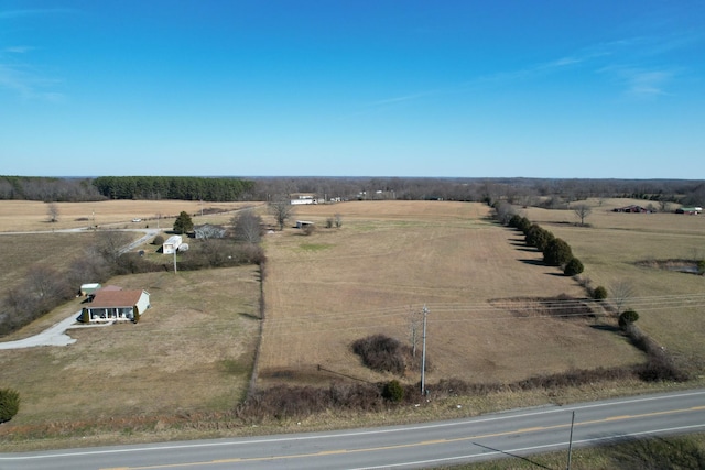 birds eye view of property with a rural view