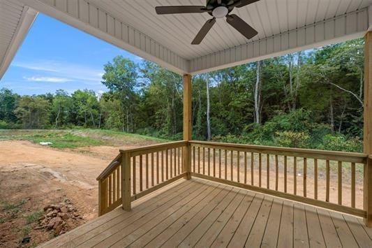 wooden deck featuring ceiling fan