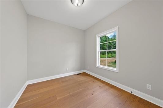 unfurnished room featuring wood-type flooring