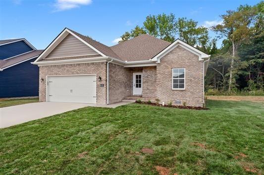 view of front of home with a garage and a front yard