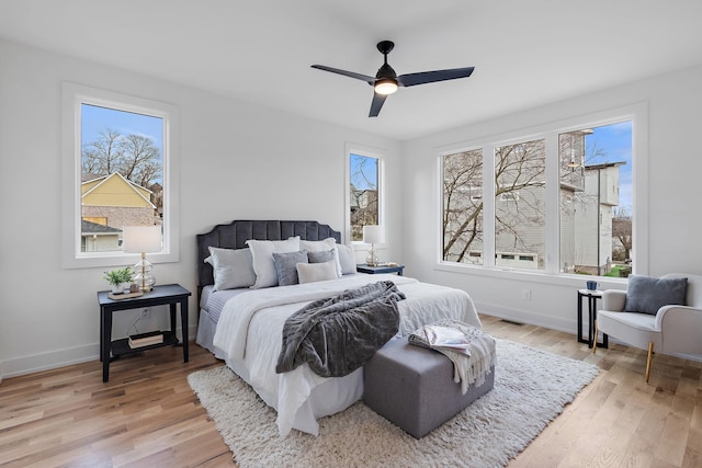 bedroom featuring light hardwood / wood-style flooring and ceiling fan