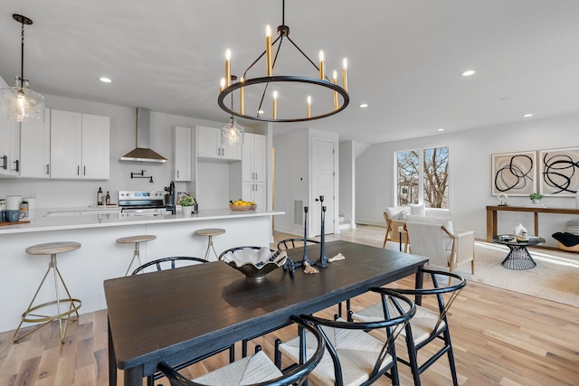 dining space featuring light wood-type flooring