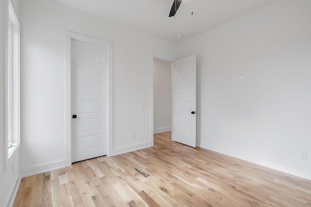 unfurnished bedroom featuring ceiling fan and light hardwood / wood-style flooring