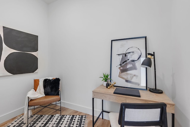 office with light hardwood / wood-style flooring