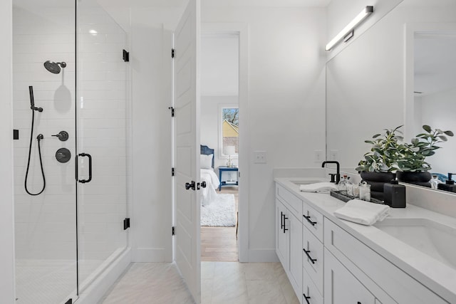 bathroom featuring vanity and an enclosed shower