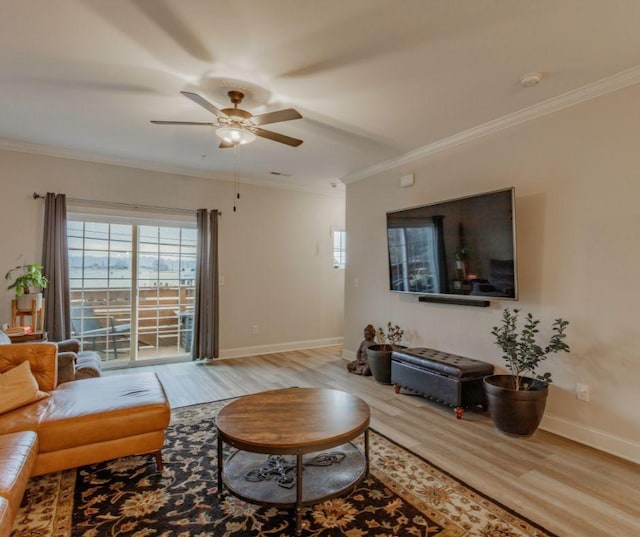 living room with crown molding, ceiling fan, and hardwood / wood-style floors