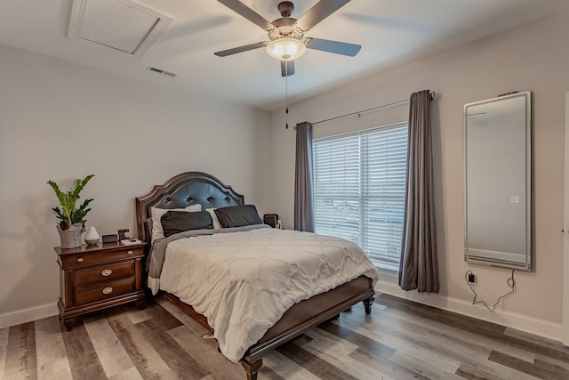 bedroom with hardwood / wood-style flooring and ceiling fan