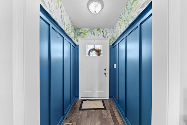 doorway with dark hardwood / wood-style flooring