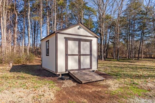 view of outbuilding with a lawn