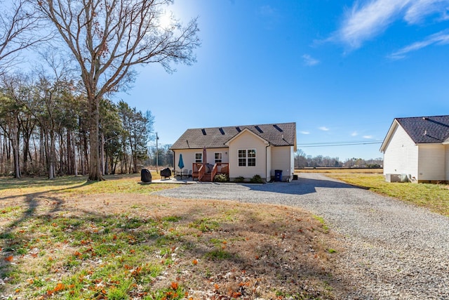 rear view of property featuring a deck