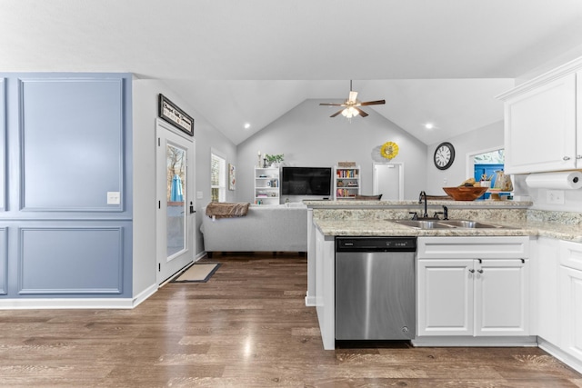 kitchen featuring sink, white cabinets, stainless steel dishwasher, light stone counters, and dark wood-type flooring