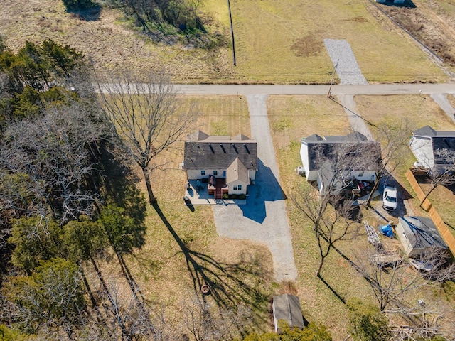 birds eye view of property with a rural view