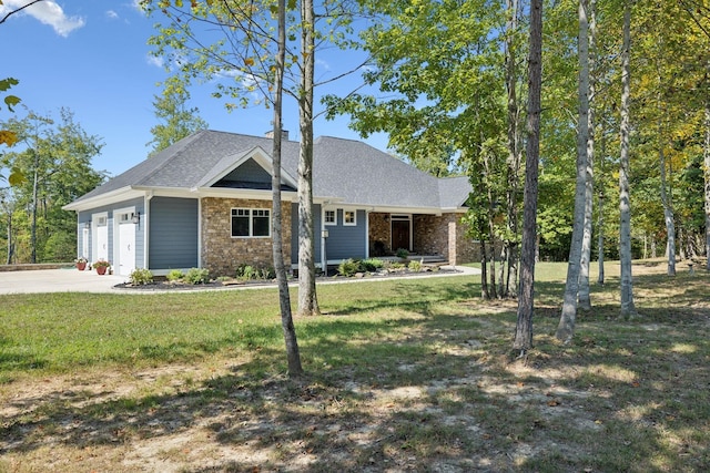 view of front of property with a garage and a front yard