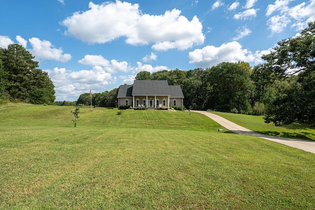 view of front of house with a front yard and covered porch