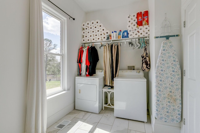 laundry room with washer and clothes dryer