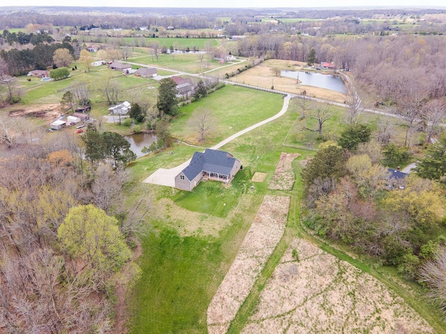 bird's eye view featuring a water view and a rural view