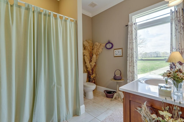 bathroom featuring crown molding, vanity, toilet, and tile patterned flooring