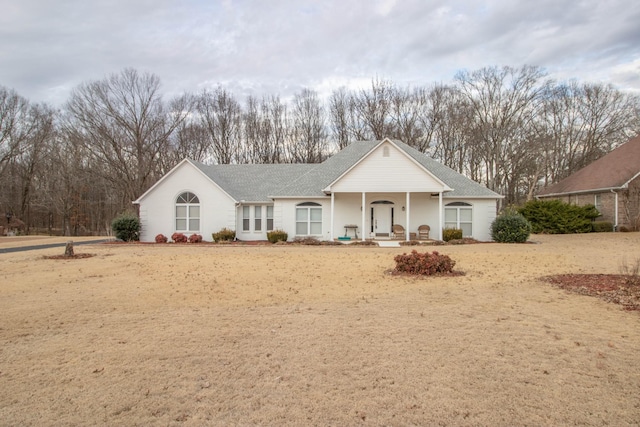 single story home featuring a porch