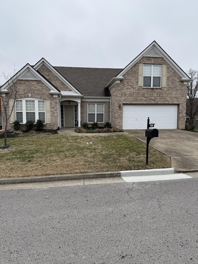 view of front of house featuring a garage and a front lawn