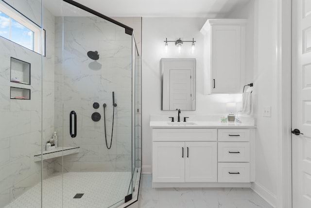 bathroom featuring vanity and a shower with shower door