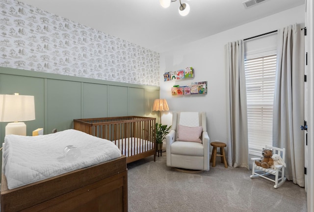 bedroom featuring light carpet