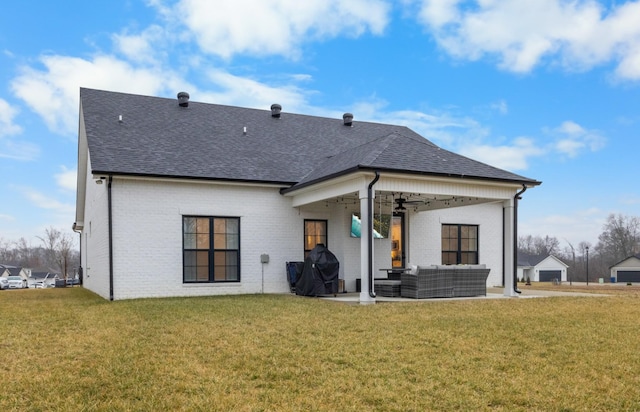 back of property featuring a patio, an outdoor hangout area, a yard, and ceiling fan