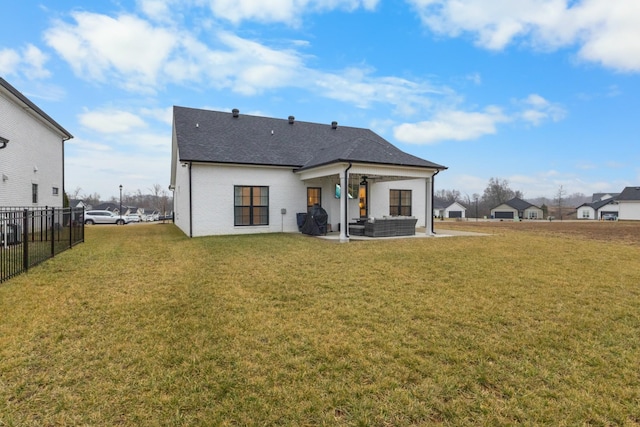 back of house featuring a yard, an outdoor hangout area, and a patio area