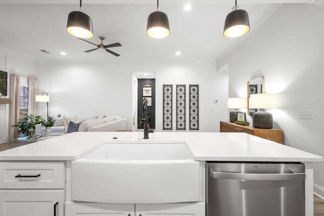 kitchen featuring ornamental molding, decorative light fixtures, dishwasher, and white cabinets