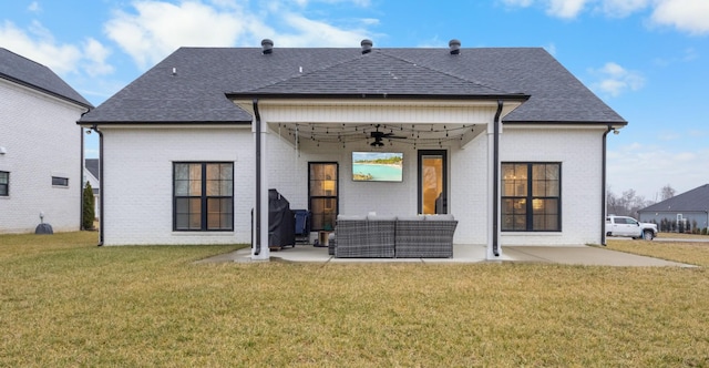 back of house featuring a patio, an outdoor hangout area, ceiling fan, and a lawn