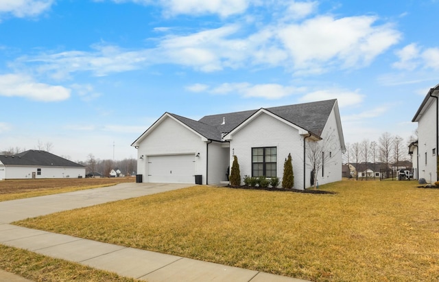 view of front of home featuring a garage and a front lawn