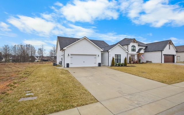 view of front of house with a garage and a front yard