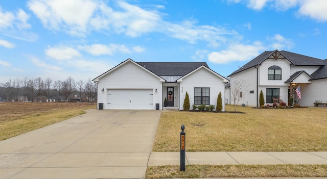 view of front of property with a garage and a front yard