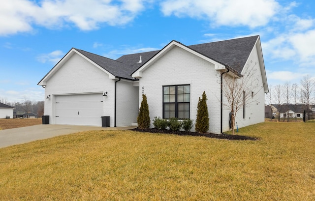 view of front of home featuring a garage and a front yard