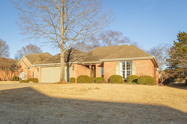 view of front of house with a garage and a front yard