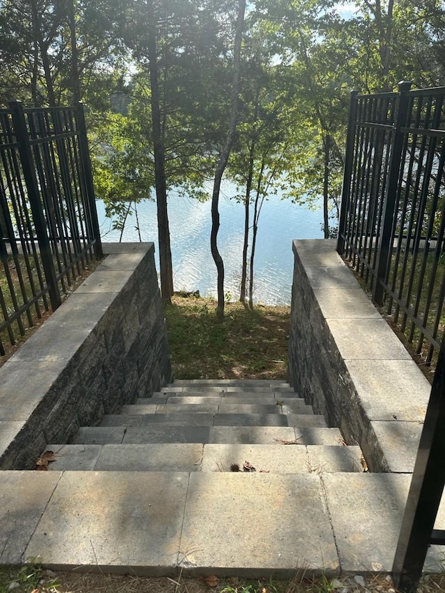 staircase with a water view