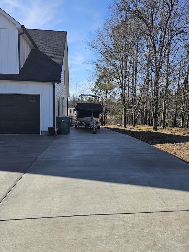 view of side of property with a garage